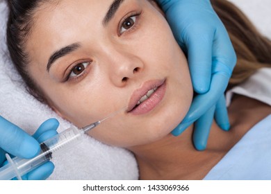 Young Woman Undergoing Procedure Of Bb Glow Treatment In Beauty Salon