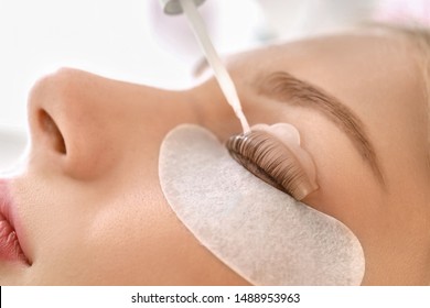 Young Woman Undergoing Procedure Of Eyelashes Lamination In Beauty Salon, Closeup
