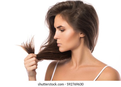 Young Woman Is Unhappy With Split Ends Of Her Hair