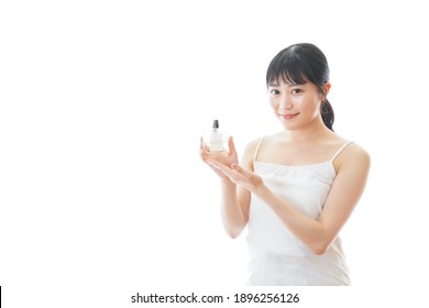 Young Woman Use Perfume Spray