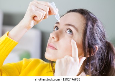 Young woman uses eye drops for eye treatment. Redness, Dry Eyes, Allergy and Eye Itching