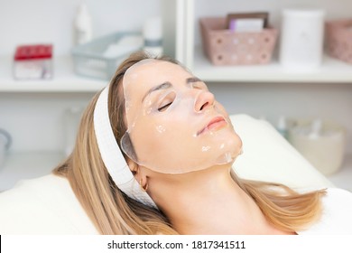 Young Woman Uses A Hydrogel Mask On Her Face.