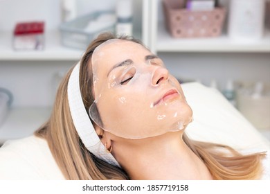 Young Woman Uses A Hydrogel Mask On Her Face.