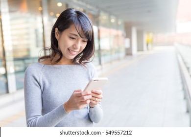 Young woman using cellphone