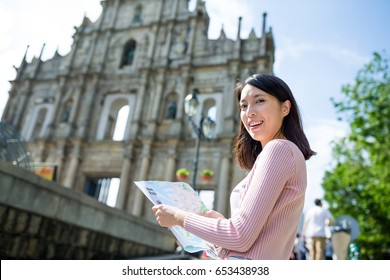Young Woman using city map in Macao city - Shutterstock ID 653438938