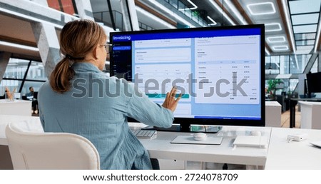Young Woman Using Computer To Create Electronic Invoice For Accounting.