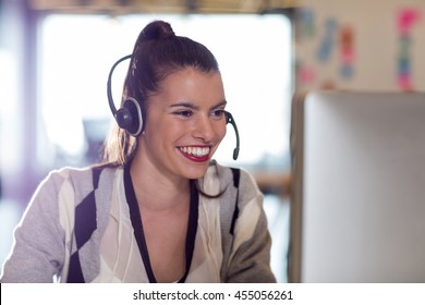 Young woman using computer in creative office - Shutterstock ID 455056261