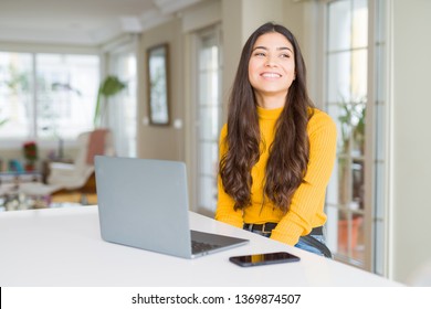Young woman using computer laptop looking away to side with smile on face, natural expression. Laughing confident. - Shutterstock ID 1369874507