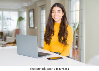 Young woman using computer laptop with a happy and cool smile on face. Lucky person. - Shutterstock ID 1484975651