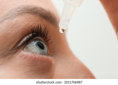 Young woman using eye drops, closeup view - Shutterstock ID 2011706987