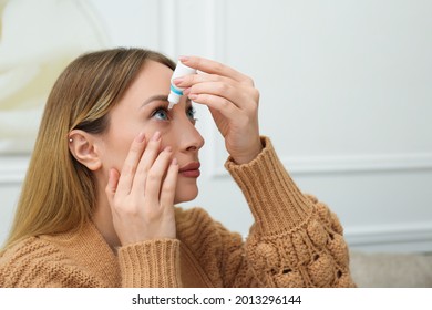 Young Woman Using Eye Drops At Home