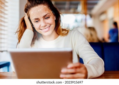 Young Woman Using Face Recognition Via Smart Mobile Phone Indoors, Biometric Verification