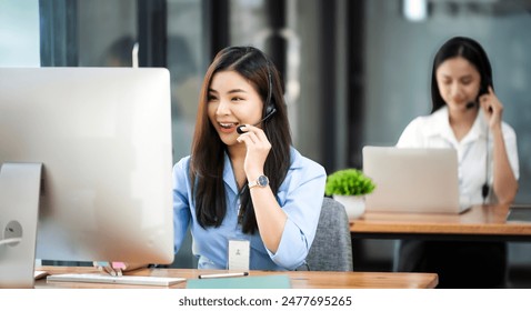 Young woman using a headset and computer in a modern office, Customer Service Representative, Service, Call Center, Using Phone, Office - Powered by Shutterstock