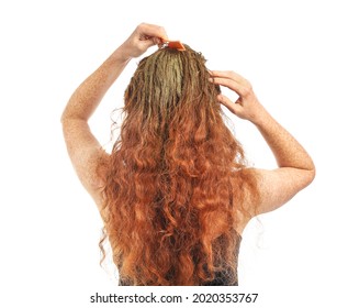 Young Woman Using Henna Hair Dye On White Background