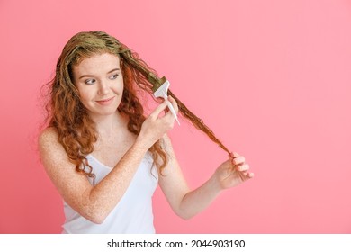 Young Woman Using Henna Hair Dye On Color Background