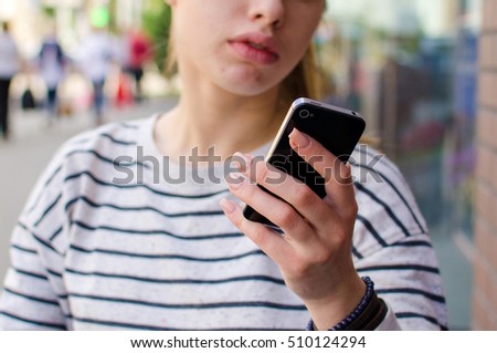 Similar – Young Woman Checking Her Mobile Phone