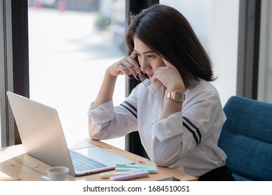 young woman using laptop computer while sitting at cafe background, technology and lifestyle. Beautiful young business woman looking at her laptop. - Shutterstock ID 1684510051