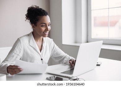 Young woman using laptop computer at home. Businesswoman working in office. Work or study from home, freelance, business, creative occupation, distance education, e-learning, lifestyle concept