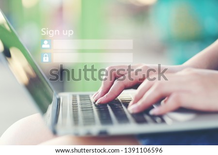Young woman using laptop computer and sign up or log in username password in coffee shop,GDPR.cyber security and privacy concept
