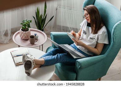 Young Woman Using Mobile Phone And Laptop, Write To Work Home, Multitasking, Remote Work