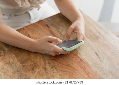 Young Woman Using Mobile Phone, Hands Only