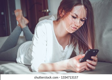 young woman using new smartphone with face id technology