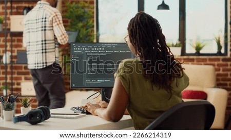 Young woman using source code to develop new online app, working with html script on terminal window to program database software. IT manager planning artificial intelligence network.