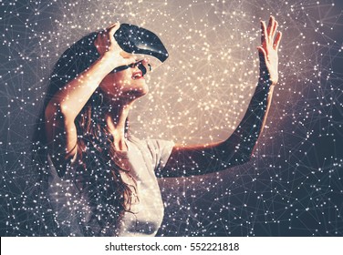 Young woman using a virtual reality headset with conceptual network lines - Shutterstock ID 552221818