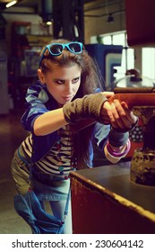 Young Woman In USSR 80s Style Posing In A Museum Of Gaming Machines In Moscow