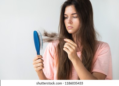 Young woman is very upset because of hair loss