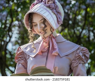 Young Woman In Vintage 19th Century Dress
Holding A Book