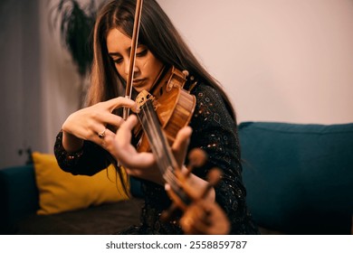 Young woman violinist playing the violin. - Powered by Shutterstock