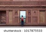 A young woman visit Agra Fort in Agra, India. The fort is a UNESCO World Heritage site.