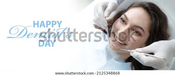 Young\
woman visiting dentist in clinic. World Dentist\
Day