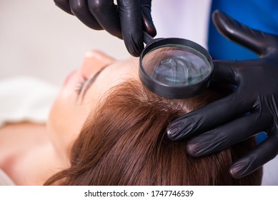 Young Woman Visiting Male Beautician In Hair Transplantation Con