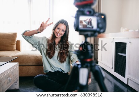Similar – Image, Stock Photo Young woman recording with smartphone stabilizer outdoors