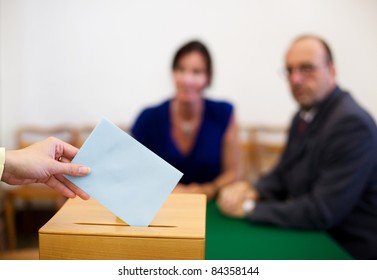 A Young Woman With A Voter In The Voting Booth. Voting In A Democracy