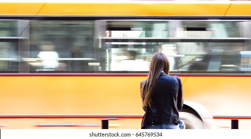 Young Woman Waiting For The Bus