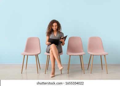Young woman waiting for job interview indoors