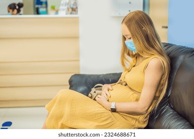 young woman in the waiting room interview sitting on sofa in corridor of dentist office or reception modern medical center while doctor's appointment. using mobile phone fills information or resumes - Powered by Shutterstock