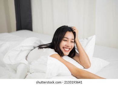 Young Woman Wake Up Before Lying Asleep Enjoying Healthy In The Morning.  Beautiful Asian Woman Sleeping Well In Comfortable Cozy Fresh Bed On Soft Pillow White Linen.