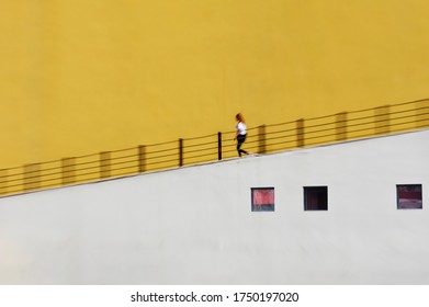 A Young Woman Walking Downhill  (blurred Motion)