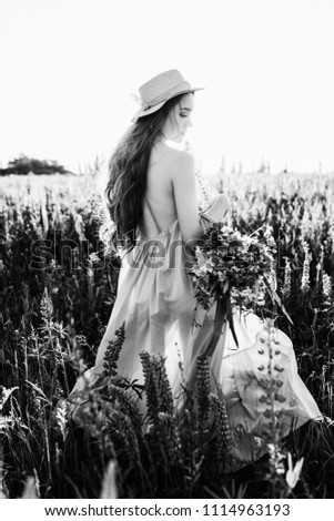 Similar – Woman posing in field of white flowers