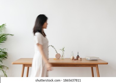 Young Woman Walking In A Living Room