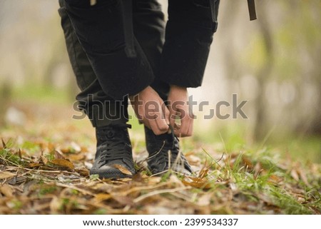 young woman walking, sitting, resting, drinking tea in the forest