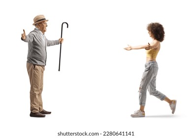 Young woman walking towards a senior man with arms wide open isolated on white background