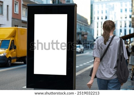 Similar – Image, Stock Photo Young woman walking past yellow building. Motion blur image. Person moving in the city.