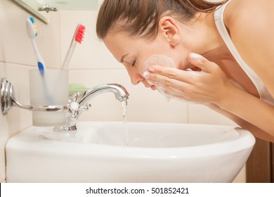 Young Woman Washing Face