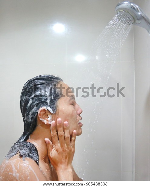 Young Woman Washing Hair Sh