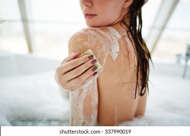 Young Woman Washing Her Body With Soap At Home